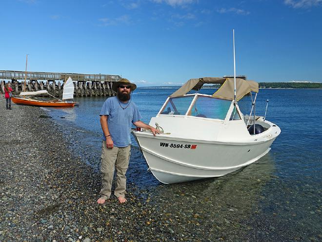 Inspecting boats on the beach